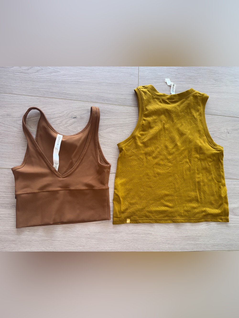 Lot of two Lululemon tanks tops size 2. Breeze by cropped pivot tank